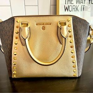 Absolutely stunning gold studded Michael Kors gold and monogram satchel.